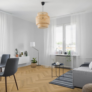 The Warren Oak Herringbone Flooring - 12mm features AC4 durability, easy Doc Loc installation, underfloor heating compatible.