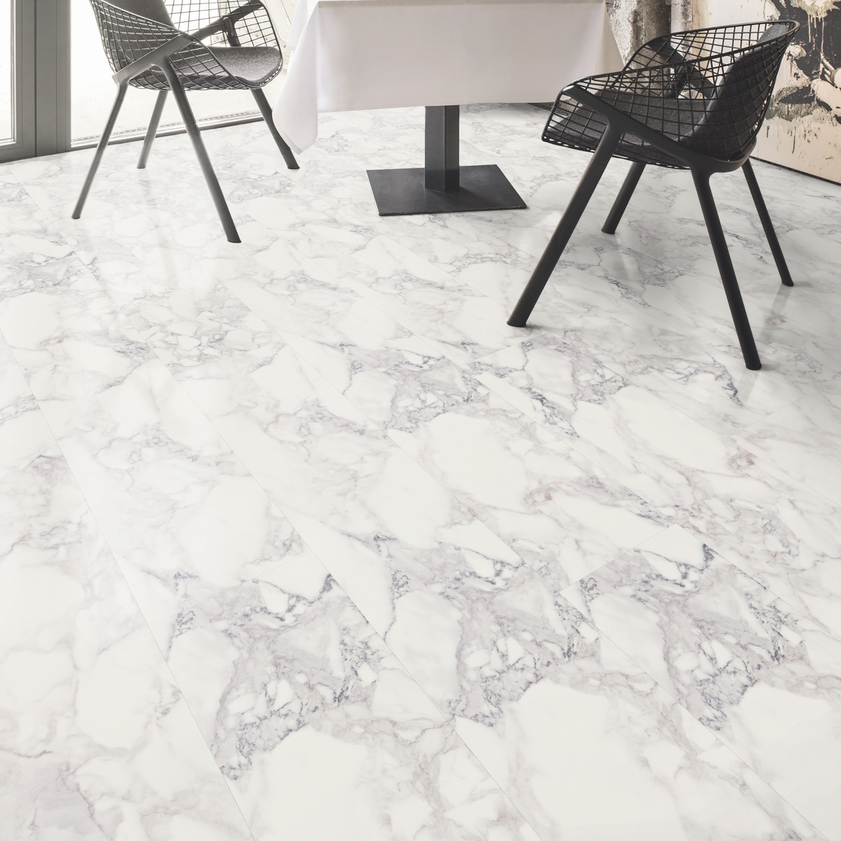 Marble-patterned laminate flooring with black chairs in a modern interior setting