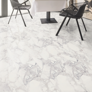 Marble-patterned laminate flooring with black chairs in a modern interior setting