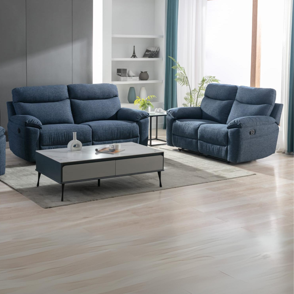 The Vera Sofa Set in Dark Blue is upholstered in dark blue and premium materials, plush cushions and spacious seating