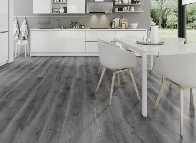 The Tomahawk Oak Laminate Flooring - 12mm features AC4 wear rating, antibacterial, realistic wood look, 20-year guarantee, underfloor heating compatible, Click2go locking system.