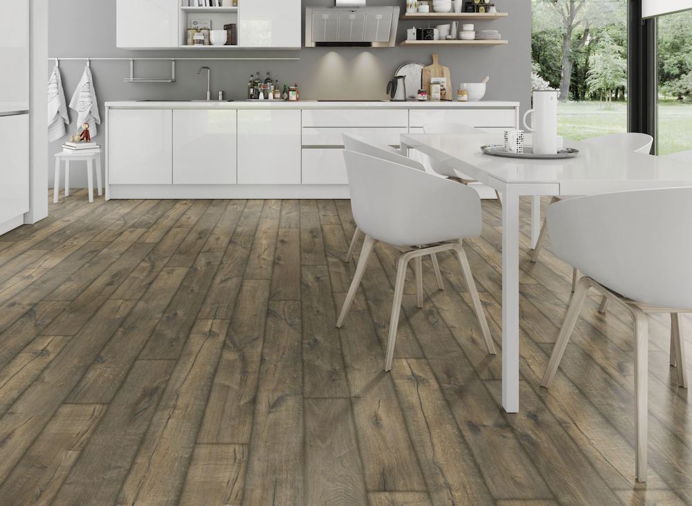 The Oak Posino Gloss Laminate Flooring - 8mm features high-gloss oak finish, AC4 durability and underfloor heating compatible.