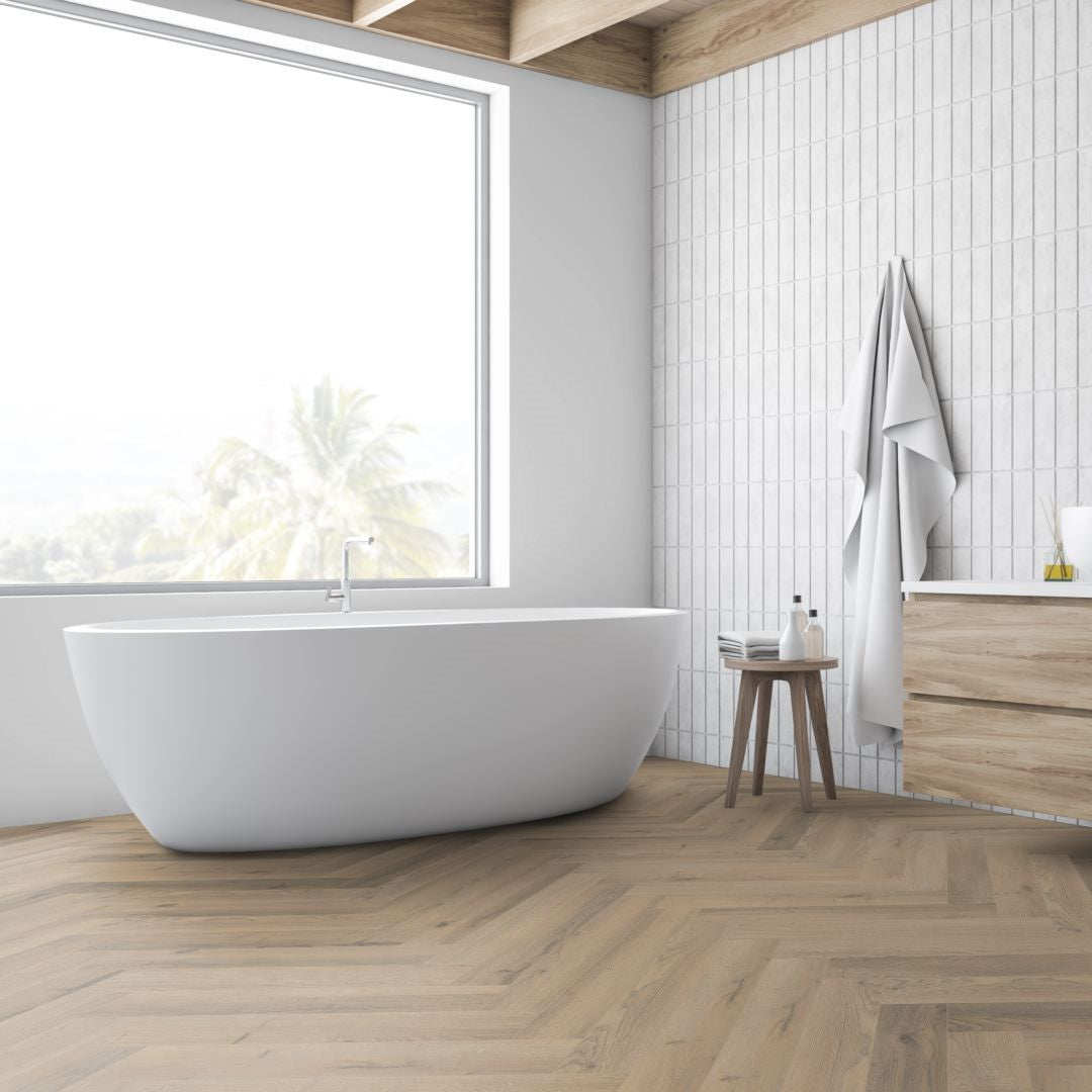 Greige Oak Herringbone Laminate Flooring 12mm: AC4-rated, durable, click-lock installation, suitable for commercial and residential spaces. Timeless herringbone design.