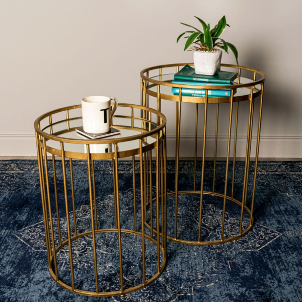 The Caged Table in Gold featuring a unique caged design with a gleaming gold finish