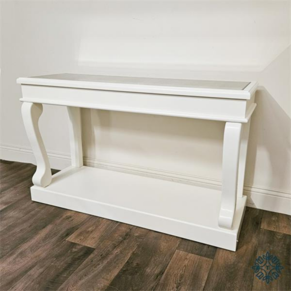 The Scroll Console Table Ivory 140CM in Antique Mirror features a crafted ivory frame and an antique mirror style finish