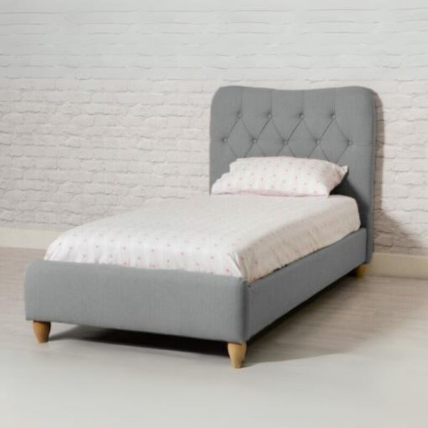 The Suzie 3ft Bed in Grey features a fabric-upholstered frame that combines comfort and style